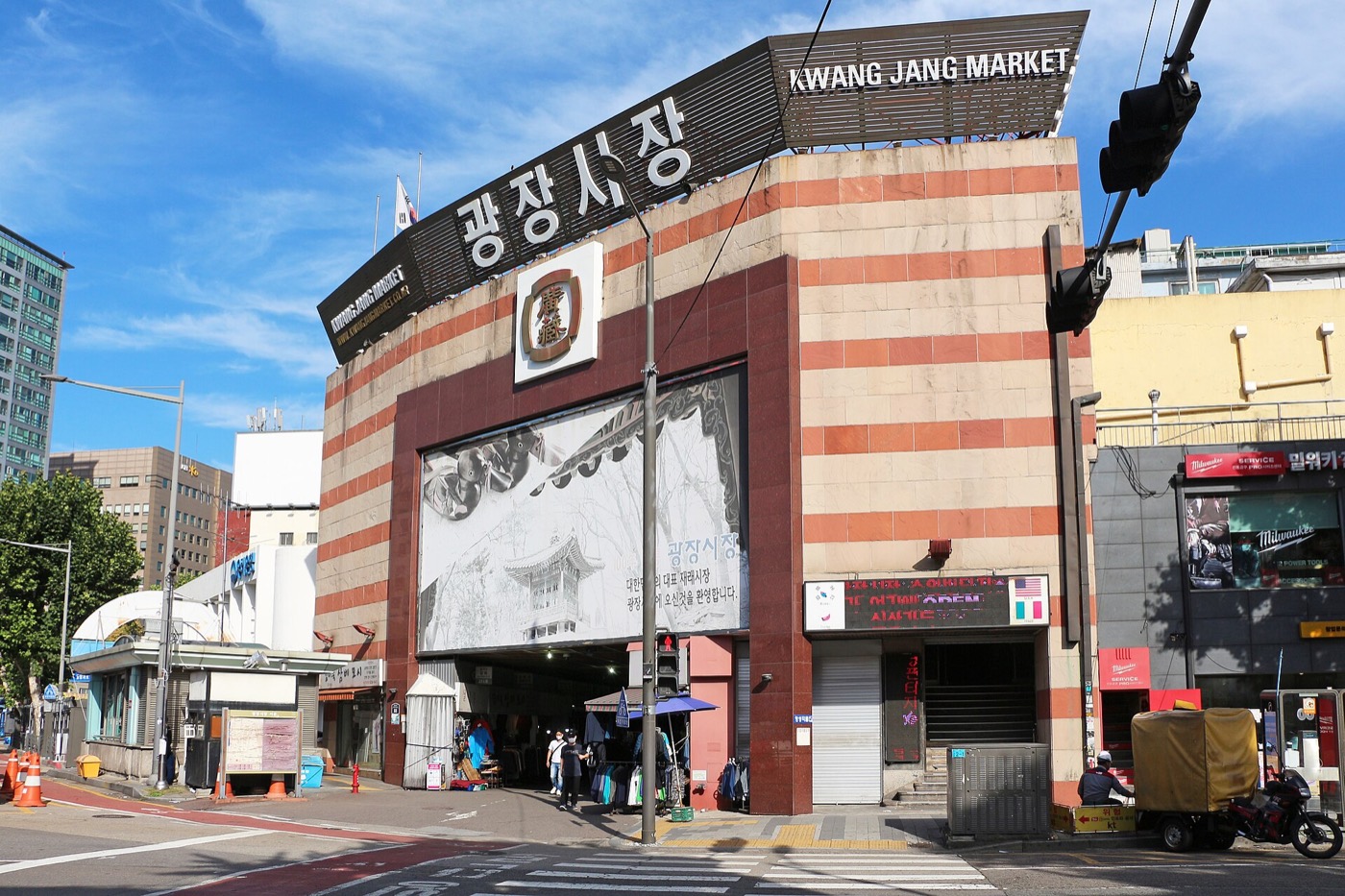 Food stalls and visitors inside Gwangjang Market in Seoul